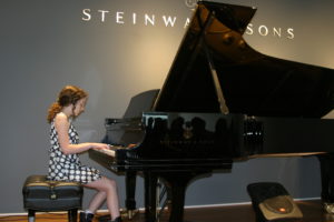 Maisie Thompson performing at Steinway & Sons Recital