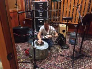 Band member Aaron Sterling getting percussion ready for recording.