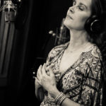 Singer songwriter Christine sings B&W at the recording studio.