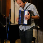 Band member Doug Petty playing accordion.