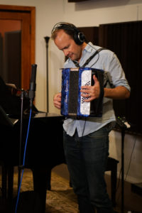 Band member Doug Petty playing accordion.